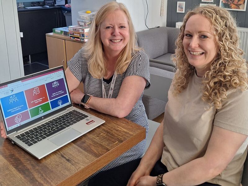 Logging on to the GIRFEC in Moray website are Sue Martin, Quality Assurance and Improvement Officer, and Laura Russell, Locality Network Lead Officer.