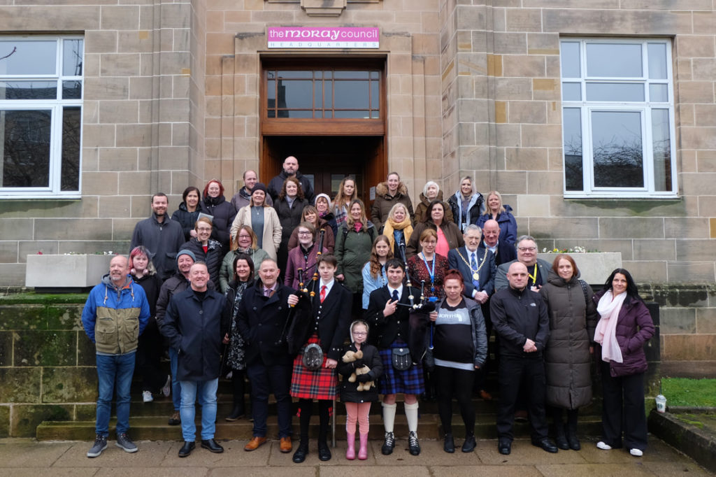 Participants standing outside the Moray Council HQ on 9th Annual Care Day